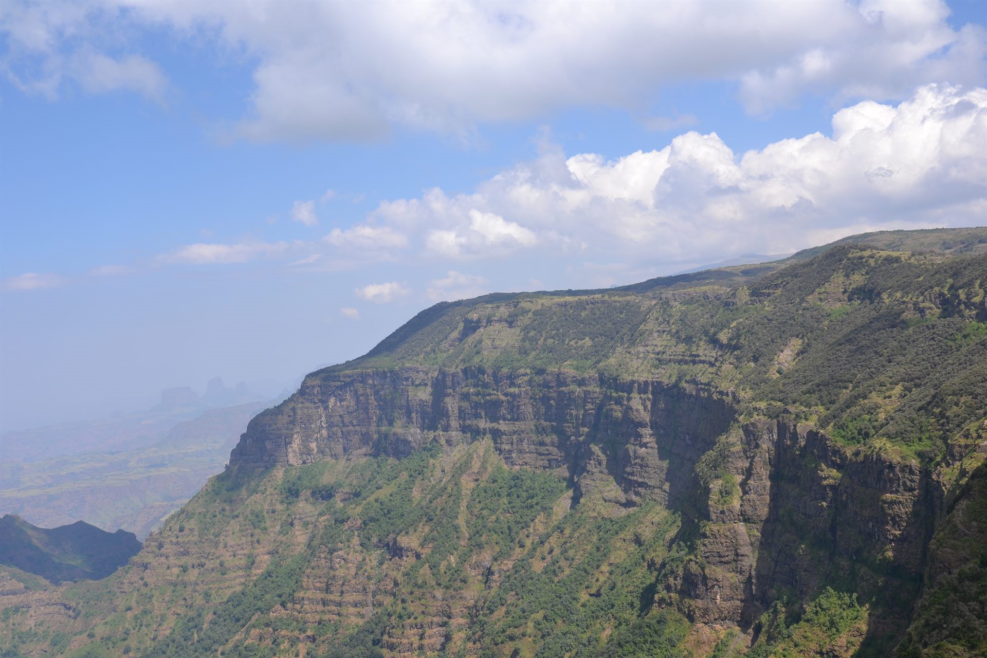 A guided trekking group crossing the high Simien escarpment